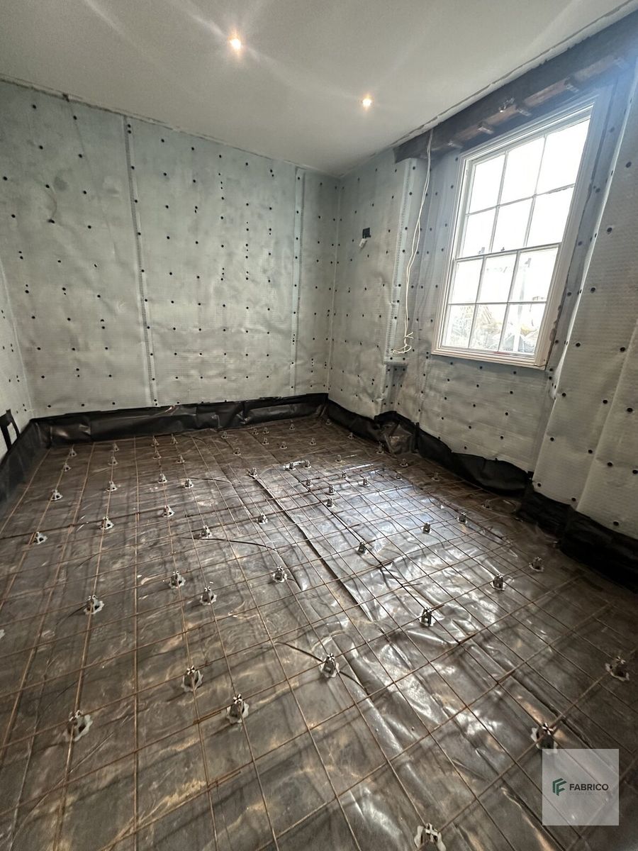 Basement floor — rebar mesh ready for concrete slab