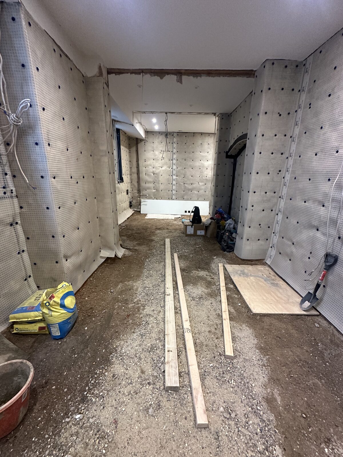 Basement structural work — brick walls and new ceiling
