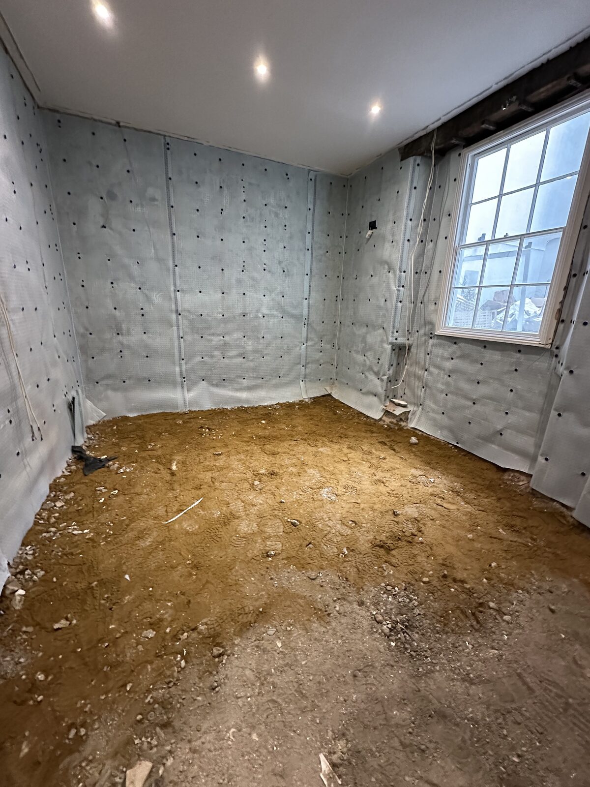 Basement tanking — membrane and floor preparation