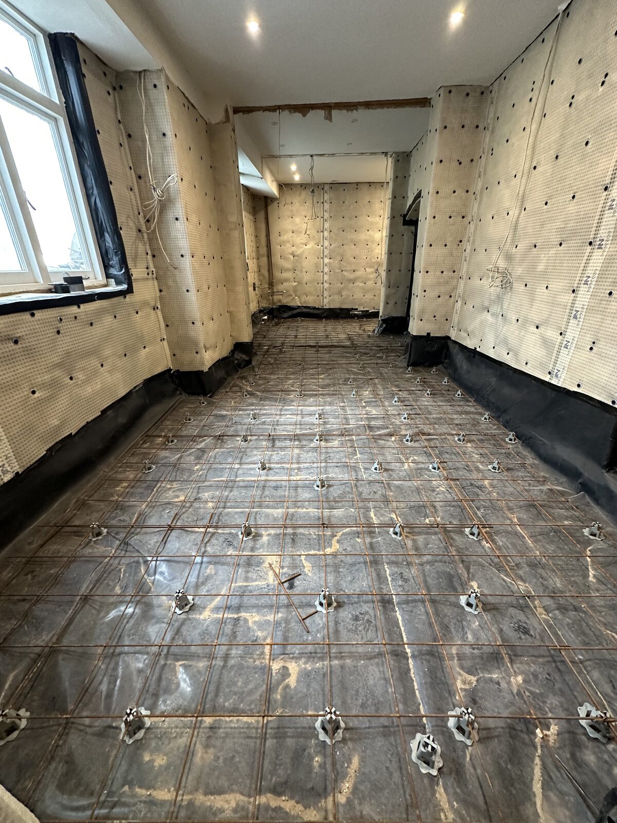 Cavity drain membrane — multiple rooms covered