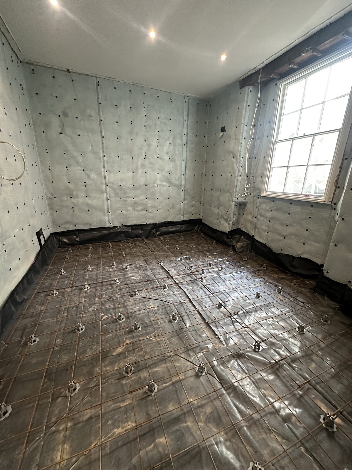 Rebar and DPM floor preparation for basement concrete pour