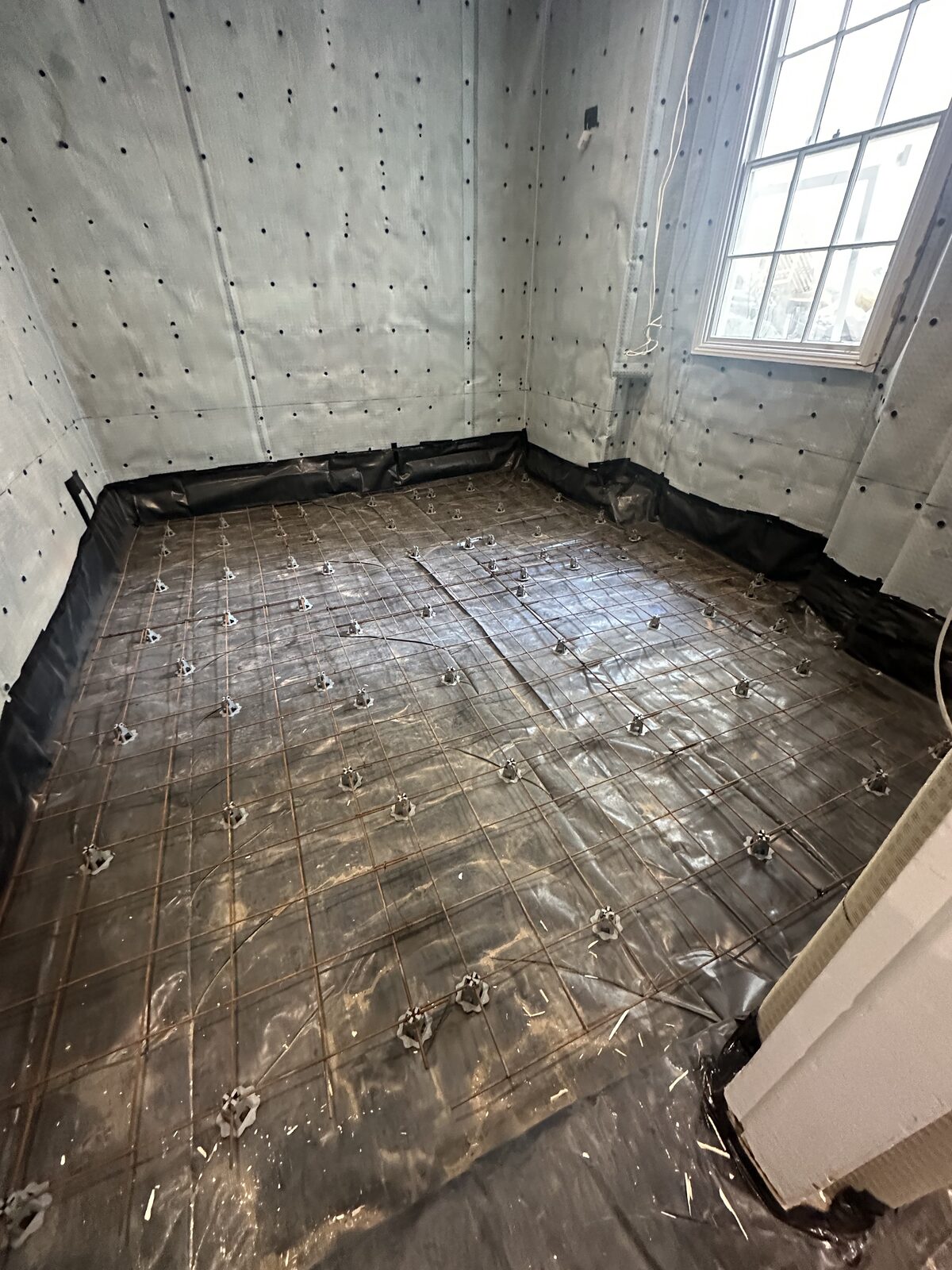 Fresh concrete slab — basement floor complete